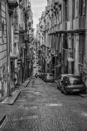 Naples, Italy - August 16, 2015 : Narrow streets of Naples, black and white photographs. View of dilapidated buildings of Naples.のeditorial素材