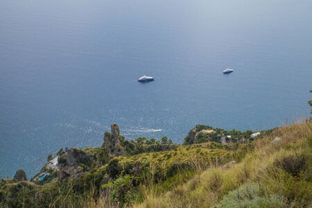 Naples, Positano Italy - August 12, 2015 : Hiking trail on the Amalfi Coast: "Sentiero degli dei" (God's way). A view from the trail down to the houses and sea.のeditorial素材