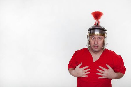 A roman soldier is looking for something on the white background.