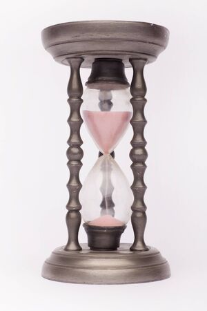 Renaissance tin hourglass on the white background, isolated