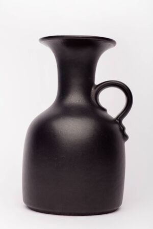 Old black vase  on the white background, isolatedの写真素材