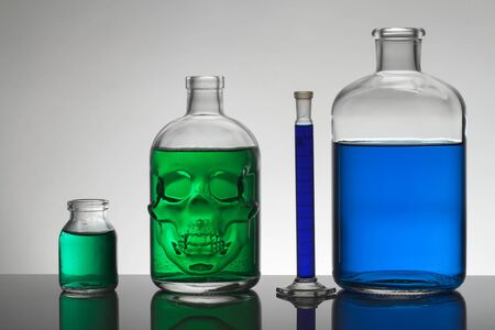 Liquid in laboratory bottles. Scientific biochemical laboratory. Colorful liquid. Isolated on white background,  a group of bottles. Test tubes.の写真素材