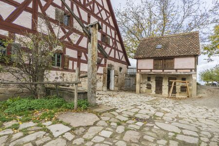 Bad Windsheim, Germany - 16 October 2019: View from a half timbered house in a german village.  View  an antique farmのeditorial素材