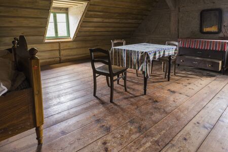 Bad Windsheim, Germany - 16 October 2019: Interior views of a german village house. View from an old rustic wooden dining table and bedroomのeditorial素材