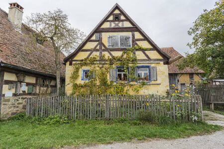 Bad Windsheim, Germany - 16 October 2019: View from a half timbered house in a german village.  A village street and meadow  in the foregroundのeditorial素材