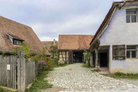 Bad Windsheim, Germany - 16 October 2019: View from a half timbered house in a german village.  A village street in the foregroundのeditorial素材