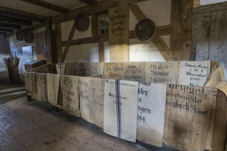 Bad Windsheim, Germany - 16 October 2019: Interior views of a german village house. Interior view of a peasant watermill, many mill bags hangのeditorial素材