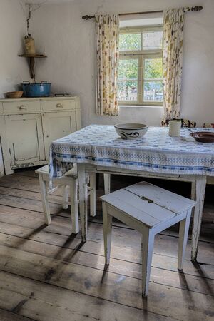 Schwaebisch Hall, Wackershofen, Germany - 15 October 2019: Interior views of a german village house. View from an old rustic wooden dining tableのeditorial素材