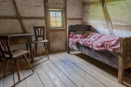 Schwaebisch Hall, Wackershofen, Germany - 15 October 2019: Interior views of a german village house. View in a german peasant bedroomのeditorial素材