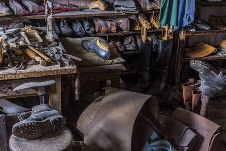 Schwaebisch Hall, Wackershofen, Germany - 15 October 2019: View into a shoemakers workshop with many old shoes and toolsのeditorial素材