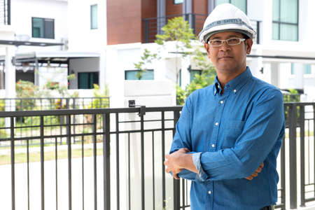 architect with hard hat at construction siteの写真素材