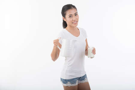 pretty asian woman drinking milkの写真素材