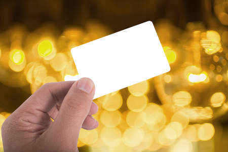 hand hold blank card over beautuful backgroundの写真素材
