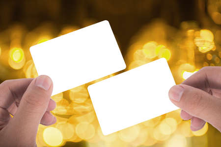 two hand hold blank card over beautuful backgroundの写真素材