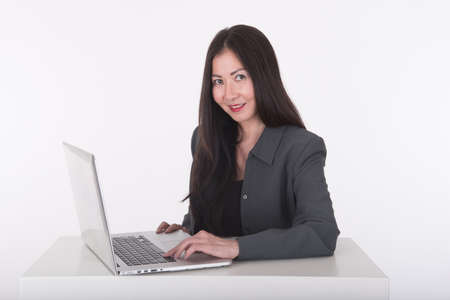 asian woman using computerの写真素材