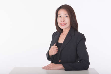 asian woman sitting on tableの写真素材