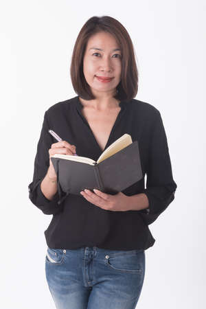 asian business woman with note bookの写真素材