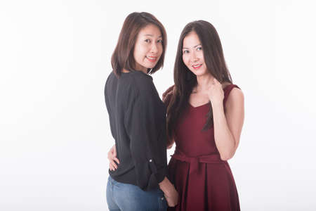 two asian woman standingの写真素材