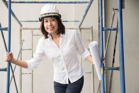 woman architect working at construction siteの写真素材
