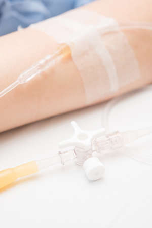 Close up saline IV drip for patient and Infusion pump in hospital.