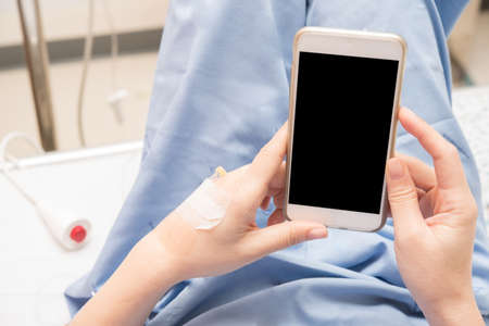 patient using smart phone in hospital