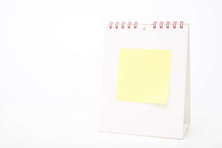 yellow note paper on  white blank Calendarの写真素材
