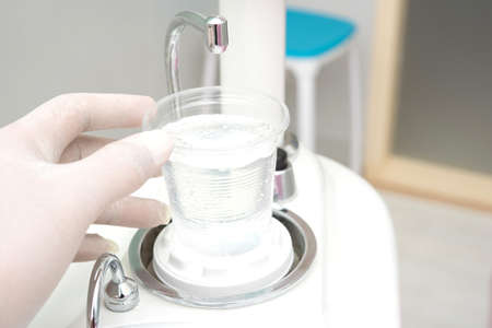 Cup of water in the dentist office.の写真素材