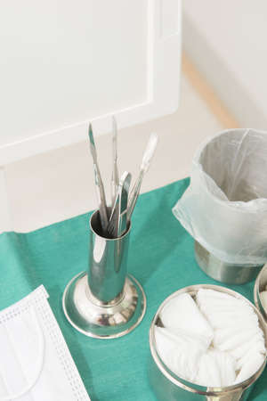 metal container with dentist equipment focus on top of metal container