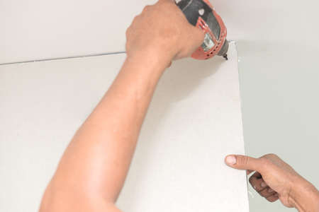 Construction worker holding the hand drillの写真素材