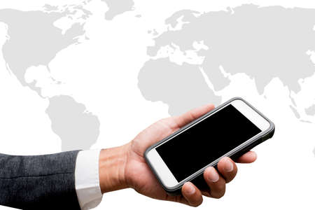 hand hold smart phone with wolrd mapの写真素材