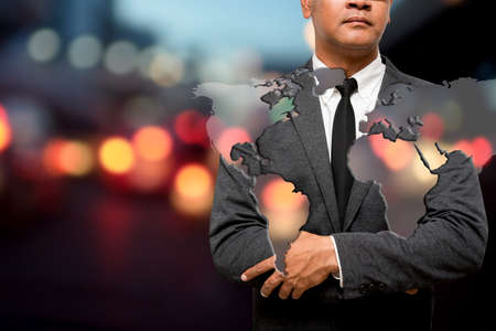 business man overlay on picture of map with light backgroundの写真素材