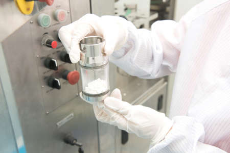 Scientist hand working at pharmacy microbiology laboratoryの写真素材