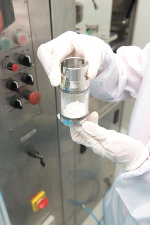 Scientist hand working at pharmacy microbiology laboratoryの写真素材