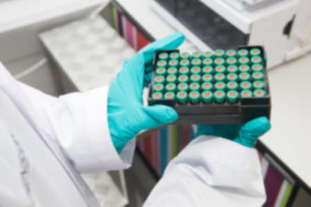 blur Scientist hand working at pharmacy microbiology laboratory