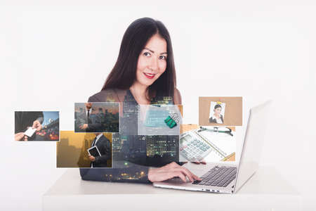 business man using computer and digital photo albumの写真素材