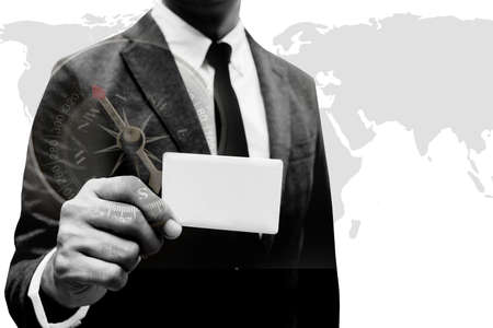 business man show  name card with world map double xposure with compass with black and white filterの写真素材