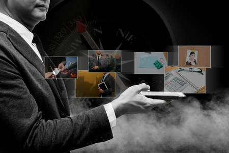 business man using smart phone and digital photo albumの写真素材