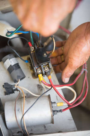 Air Conditioning Technician install new air conditioner.の写真素材