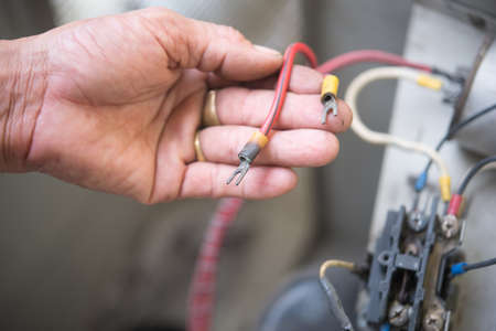 Air Conditioning Technician install new air conditioner.の写真素材