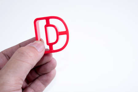 hand hold plastic alphabet Dの写真素材