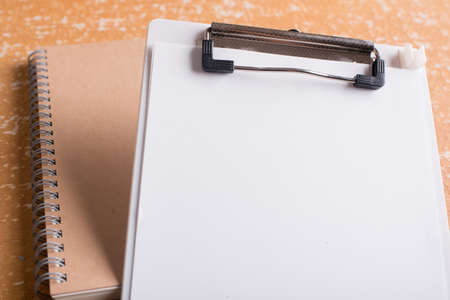 clipboard with blank paper on  wood tableの写真素材
