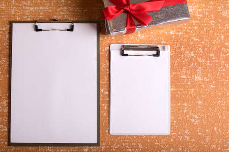 clipboard with blank paper on  wood tableの写真素材
