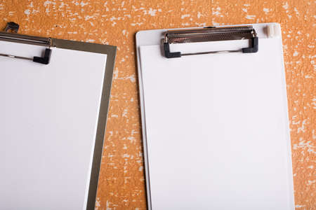 clipboard with blank paper on  wood tableの写真素材