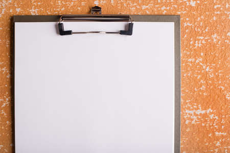 clipboard with blank paper on  wood tableの写真素材