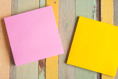 colorful note paper on wooden tableの写真素材