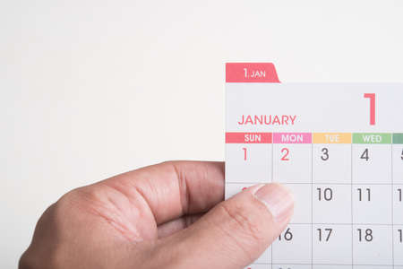 hand hold calendar on white background