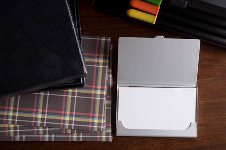 blank name card and luxury holiday decoration on wood tableの写真素材