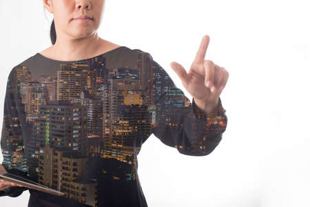 business woman double exposure with buildingの写真素材