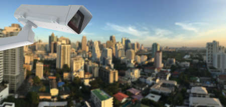 cctv camera with city in backgroundの写真素材