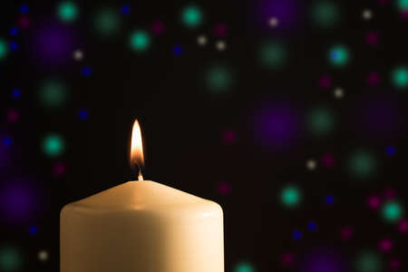 Candle with colored light backgroundの写真素材